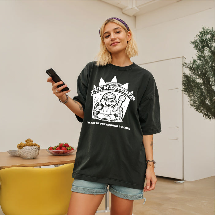 Person wearing a black t-shirt with graphic design indoors