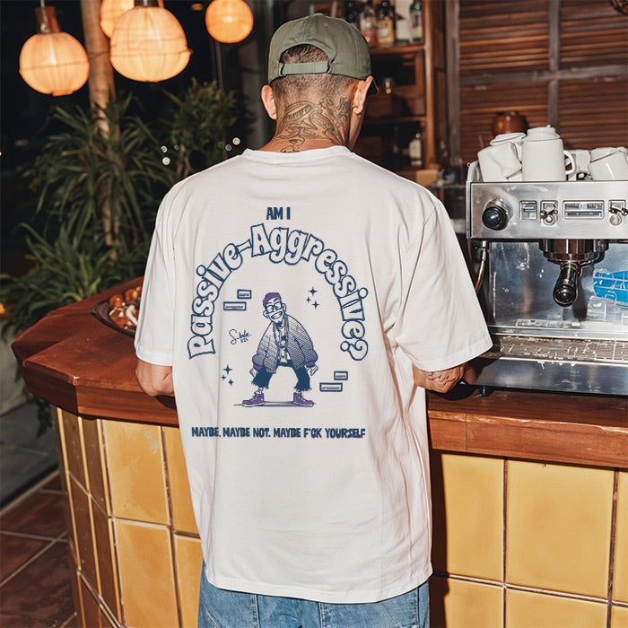 Person wearing a white t-shirt with a graphic design in a bar setting