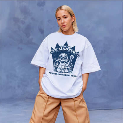 Person wearing a white t-shirt with a graphic design on a blue background