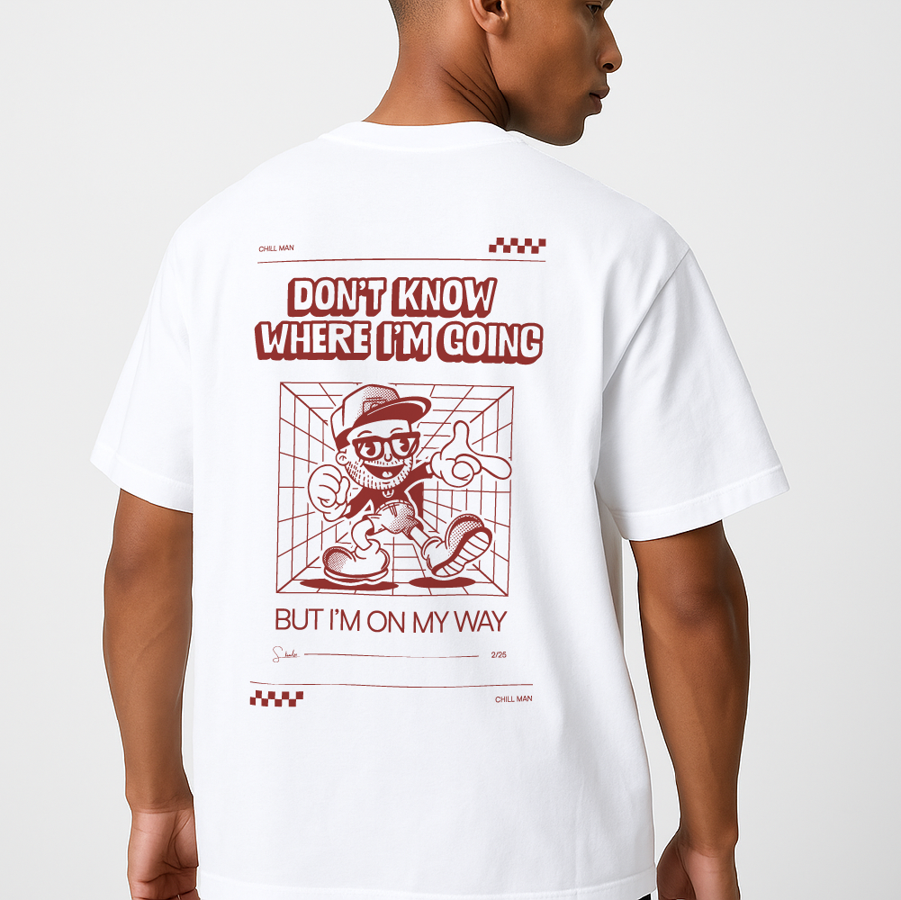 Person wearing a white t-shirt with red graphic and text on a plain background