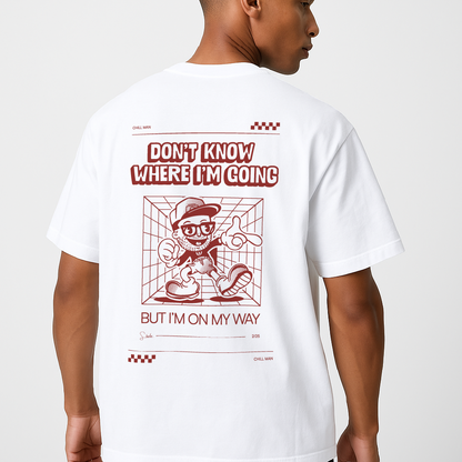 Person wearing a white t-shirt with red graphic and text on a plain background