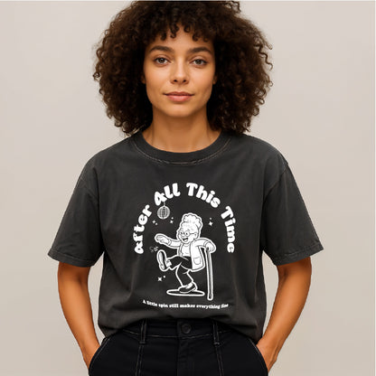 Person wearing a black t-shirt with a graphic design and text.