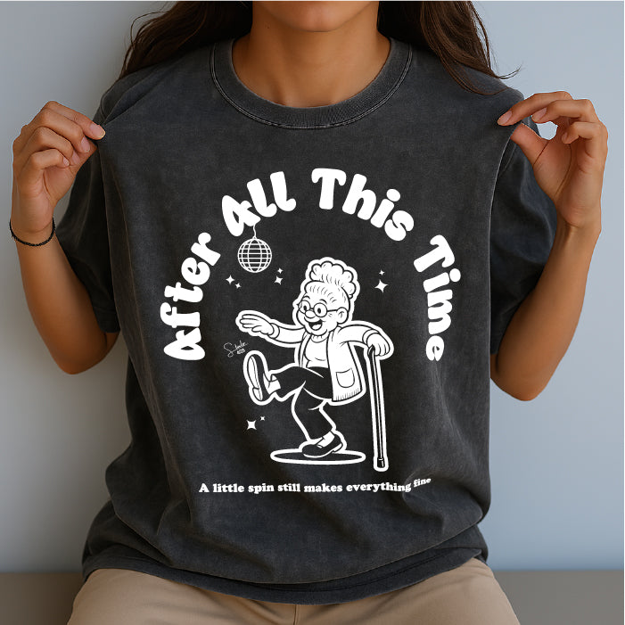 Person wearing a black t-shirt with a graphic design and text.