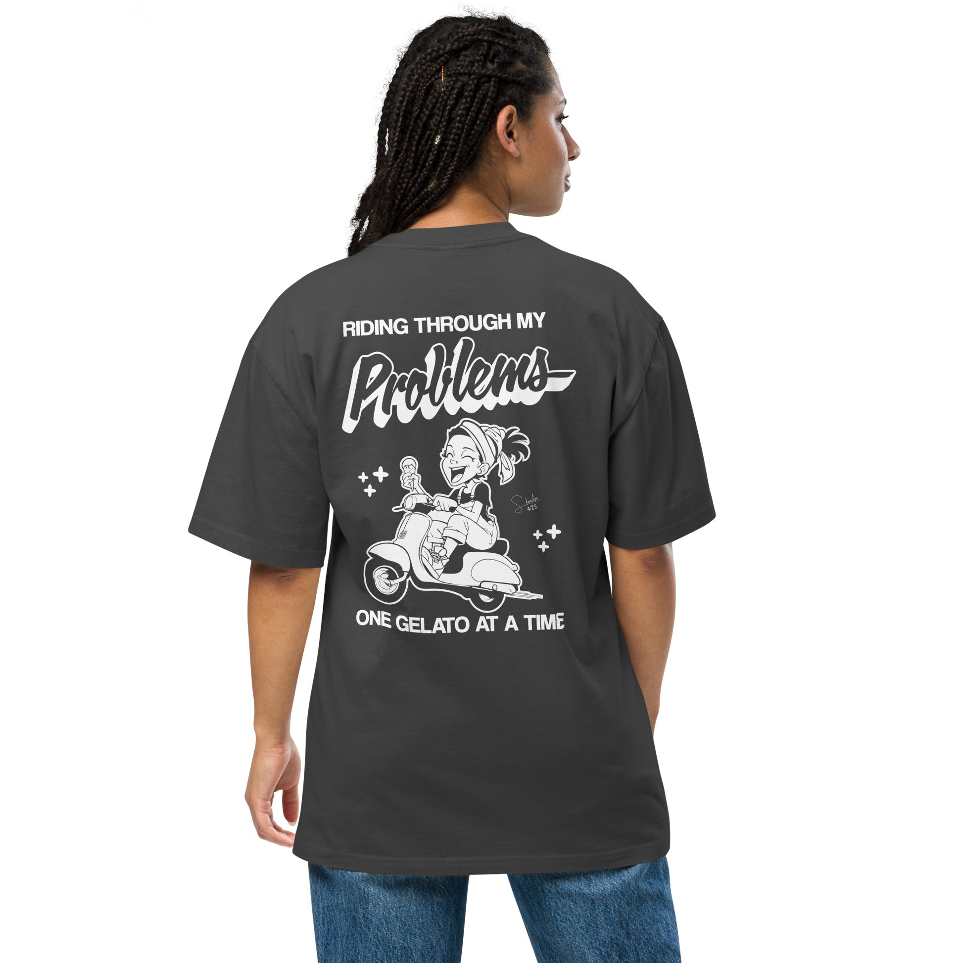 Person wearing a black t-shirt with a graphic design and text on the back, on a white background