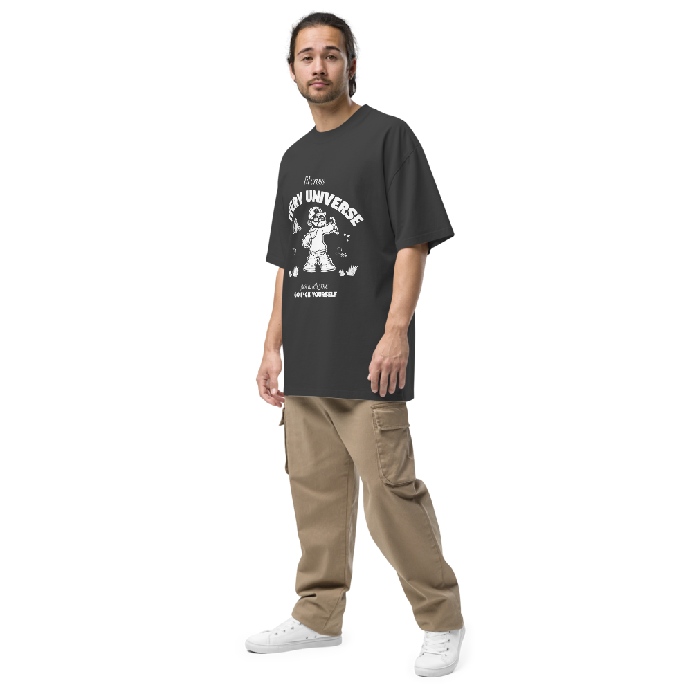 Person wearing a black t-shirt with graphic design and beige pants on a white background